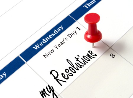 Pin on calendar pointing new year resolutions close upの写真素材