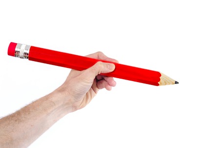 man hand writting with huge red pencil copy space on white backgroundの写真素材