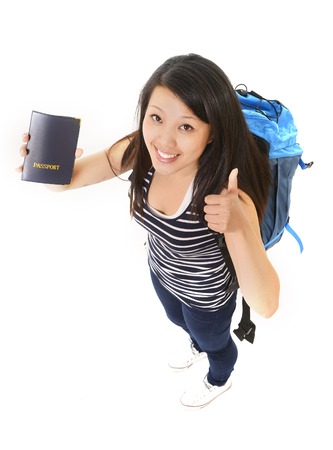 Young attractive asian chinese traveler woman showing passportの写真素材