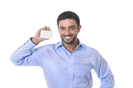 happy young attractive businessman holding blank business card for adding corporate textの写真素材