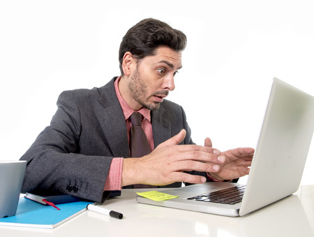 young attractive businessman in suit and tie working in stress at office computer laptop looking...