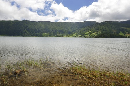 calm beautiful and peaceful landscape view Blue Lake Lagoa Azul in Sete Cidades at Sao Miguel Azores island in Portugal in tourist holiday destination landmark and vacation travel adventure conceptの写真素材