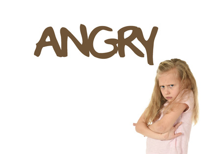 English language learning vocabulary school card with the word angry and portrait of sweet beautiful little child girl upset and moody isolated on white backgroundの写真素材