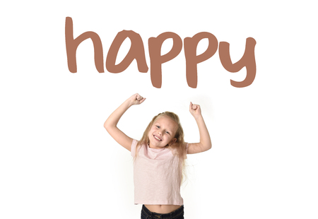 English language learning vocabulary school card of young beautiful happy female child gesturing excited and smiling cheerful rising arms isolated on white background in school girl successの写真素材