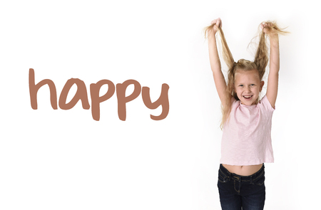 English language learning vocabulary school card of young beautiful happy female child gesturing excited and smiling cheerful rising arms isolated on white background in school girl successの写真素材