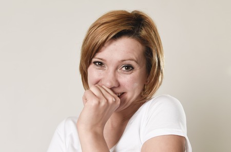 young attractive and beautiful red hair woman laughing happy and cheerful in friendly joyful face...