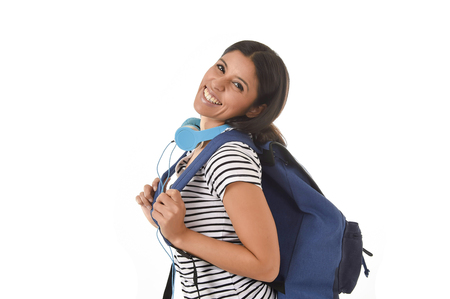 young beautiful and trendy latin student girl carrying backpack smiling happy and confident in university and college education isolated on white backgroundの写真素材