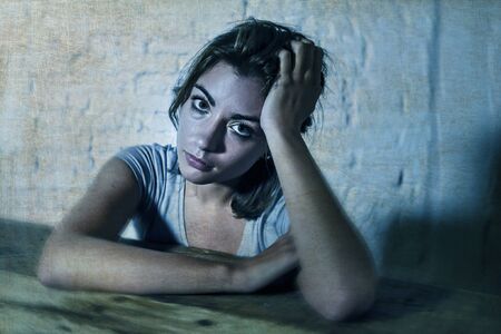young beautiful sad and depressed woman looking wasted and frustrated suffering pain and depression...