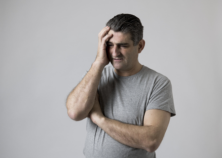 portrait of 40s to 50s sad and worried man looking frustrated and hopeless in stress and sorrow face...