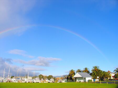 Rainbow And Harbor In New Zealandの写真素材