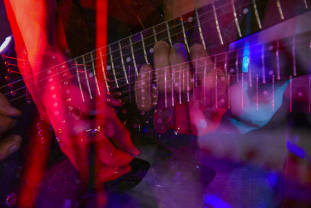 The neck of the guitar hand guitar player during the game , performer, jazz, bass, black, acoustic, handsの写真素材