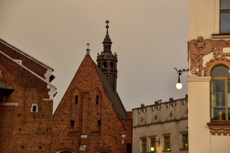 Architecture on the face of Krakow in Europe evening shooting street house roof historyの写真素材