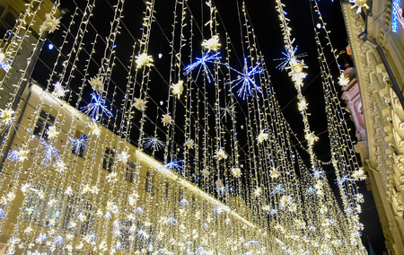 New year's bright Golden garland on the street in Moscow nightの写真素材