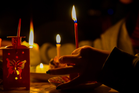 divination ritual a few different candles in the nightの写真素材