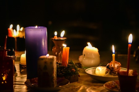 divination ritual a few different candles in the nightの写真素材