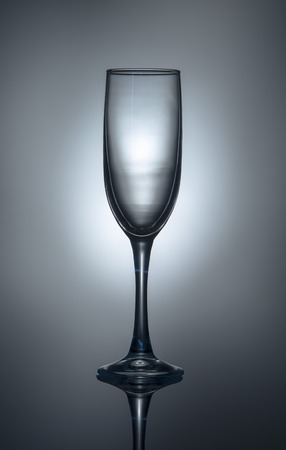 Silhouette of a champagne glass on a gray-blue background grayの写真素材