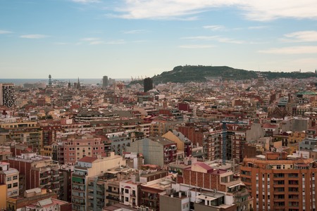 Colorful streets of Barcelona. Bright houses against the blue sky.Mountains in the background.の写真素材