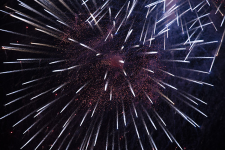 Fireworks against the dark sky. red black