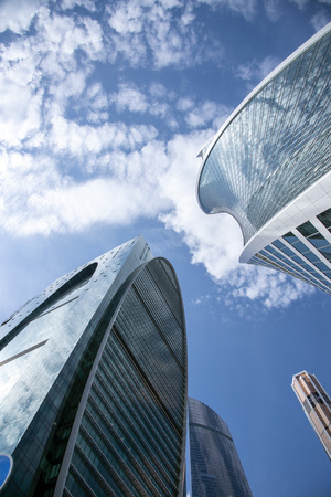 May 2019, Russia, Moscow.Bottom view of the business center Moscow city. Blue skyの写真素材