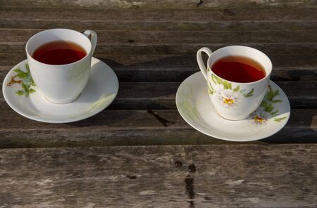 Two cups of tea stand on a wooden surface,Cozy still life.の写真素材