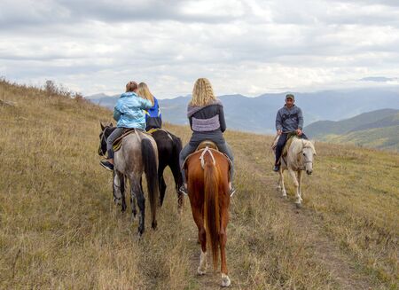 Armenia Lori region October 2019. Departure on horseback, misty mountain landscape.のeditorial素材
