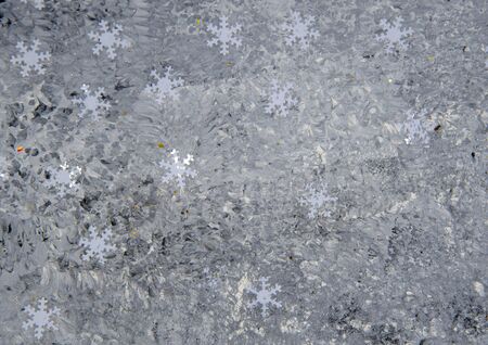 Speckled gray background with snowflakes. Christmas, textured background.の写真素材