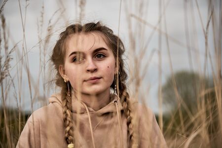 Horizontal Portrait of a teenage girl, made through the ears.