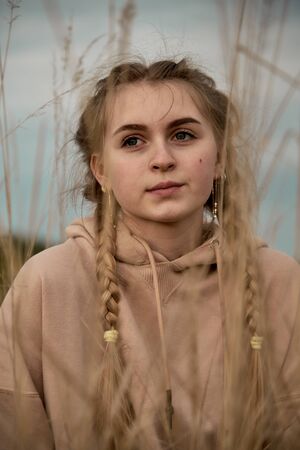 Vertical portrait of a teenage girl, made through the ears.の写真素材