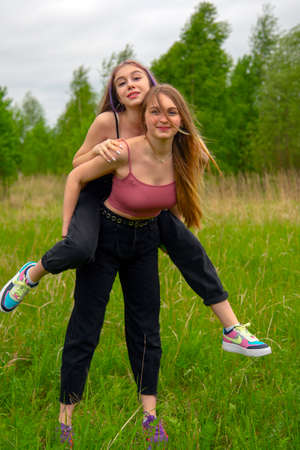 Two young girls with long hair on a walk.のeditorial素材