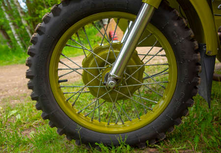 Moscow region, Russia, June 2020. Part of a retro motorcycle wheel with spokes.