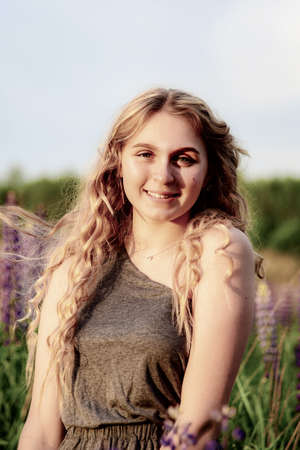 Tinted large portrait of a girl against the background of nature.の写真素材