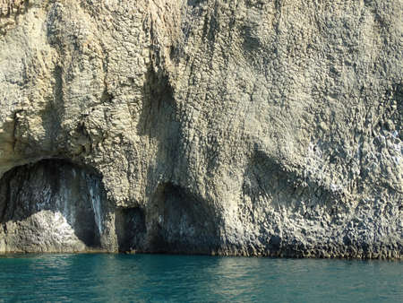 Majestic Rocks rising from the calm sea water.の写真素材