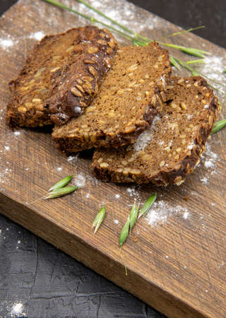 Fitness bread with seeds lies on a wooden Board.の写真素材