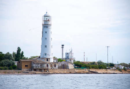 View of the old lighthouse from the sea.の写真素材