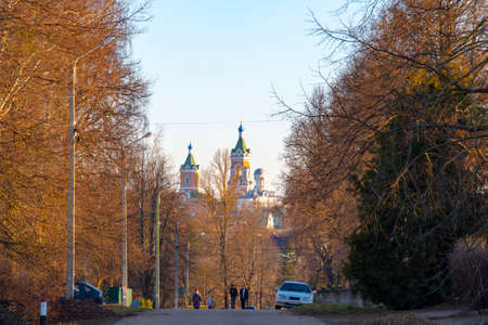 Russia, Mozhaisk, March 2020. The road in the city of Mozhaisk, leading to the temple, framed by trees.のeditorial素材