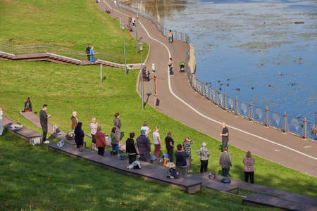 Russia, Moscow, September 2020. A group of pensioners are engaged in qigong in the Park.のeditorial素材