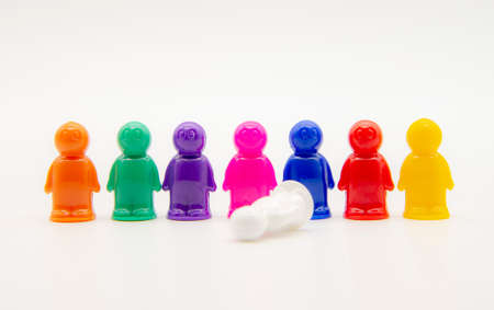 Small plastic multicolored men on a white background.の写真素材