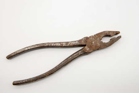 Old rusty pliers on a white background. Individual items for repair.の写真素材