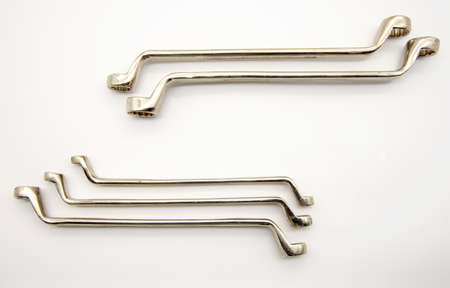 Set of metal cap wrenches on a white background.の写真素材