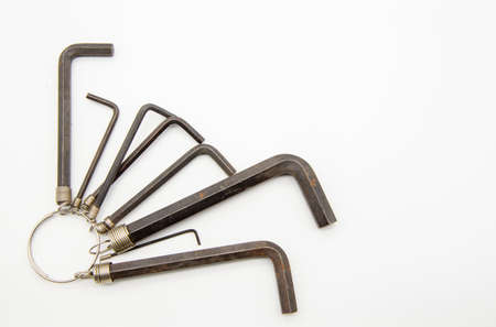 A set of hex keys hanging on one ring on a white background.の写真素材