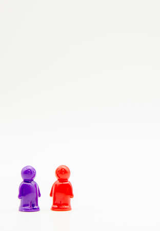 Several small plastic multicolored men on a white background.の写真素材