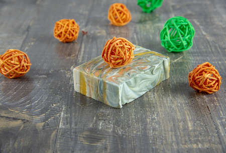 Organic scented handmade soap on a wooden gray countertop surrounded by decor. The concept of a healthy lifestyle.の写真素材