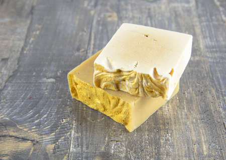 A piece of fragrant handmade soap lies on the gray countertop. The concept of a healthy lifestyle. Spa products.の写真素材