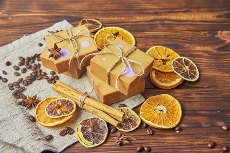Bright handmade soap, various spices on the wooden countertop. Healthy lifestyle, natural products.の写真素材
