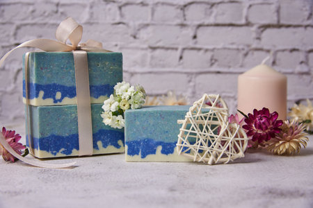 Organic handmade soap in blue tones decorated with dried flowers. Natural products, healthy lifestyle.の写真素材