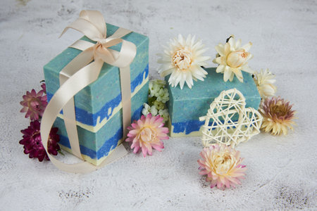 Organic handmade soap in blue tones decorated with dried flowers. Natural products, healthy lifestyle.の写真素材
