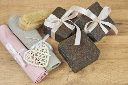 Handmade soap-scrub decorated with ribbons. Personal hygiene items, healthy lifestyle. Copy space for text.の写真素材