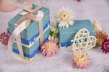 Organic handmade soap in blue tones decorated with dried flowers. Natural products, healthy lifestyle.の写真素材