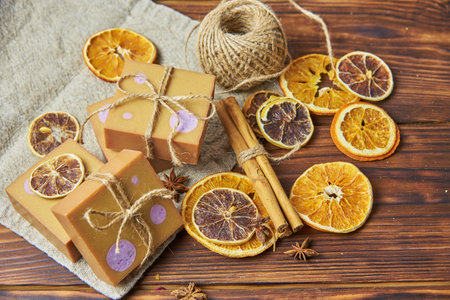 Bright handmade soap, various spices on the wooden countertop. Healthy lifestyle, natural products.の写真素材