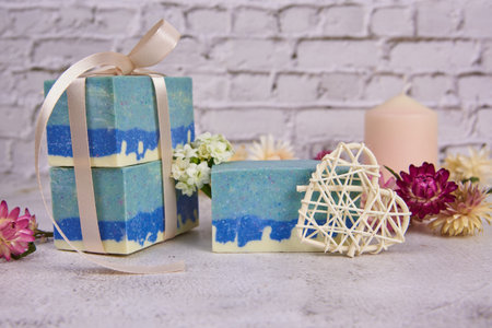 Organic handmade soap in blue tones decorated with dried flowers. Natural products, healthy lifestyle.の写真素材